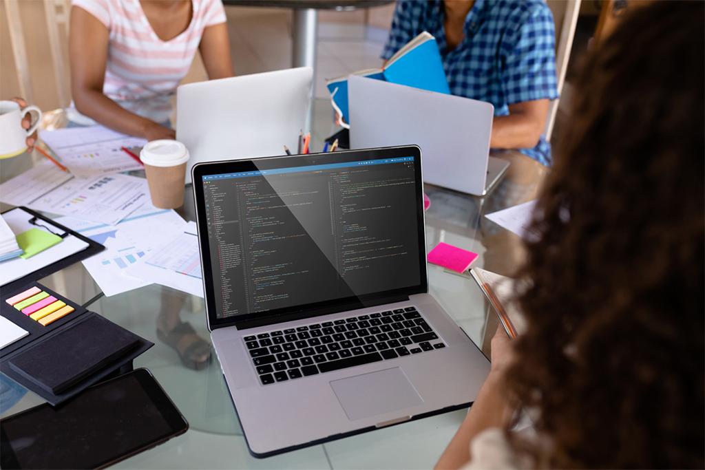 Image of a person coding on a computer
