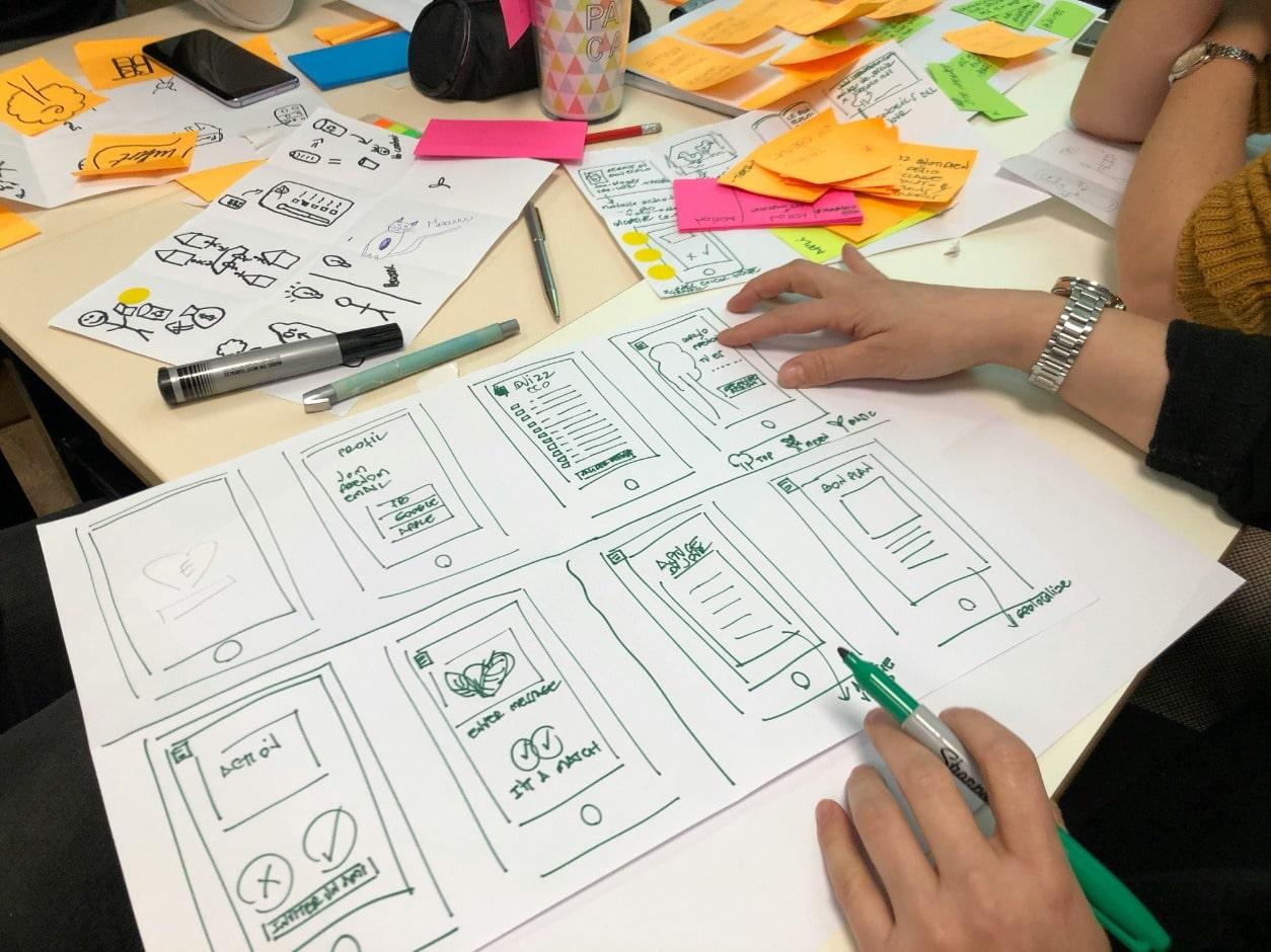 Image of a person sketching designs on paper