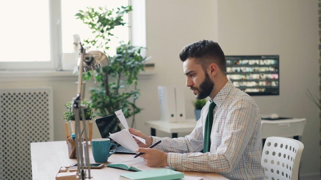 Image of a man at a desk